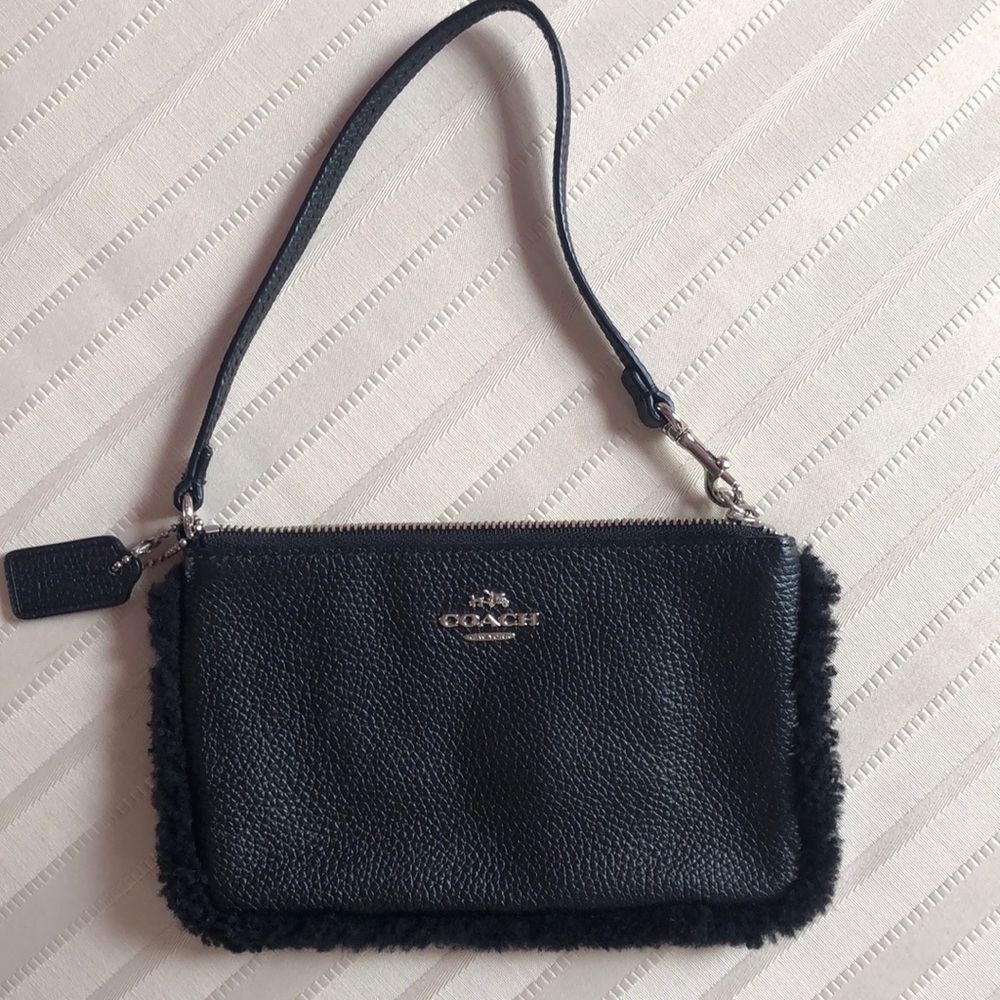 Adorable Sherpa lined Coach wristlet